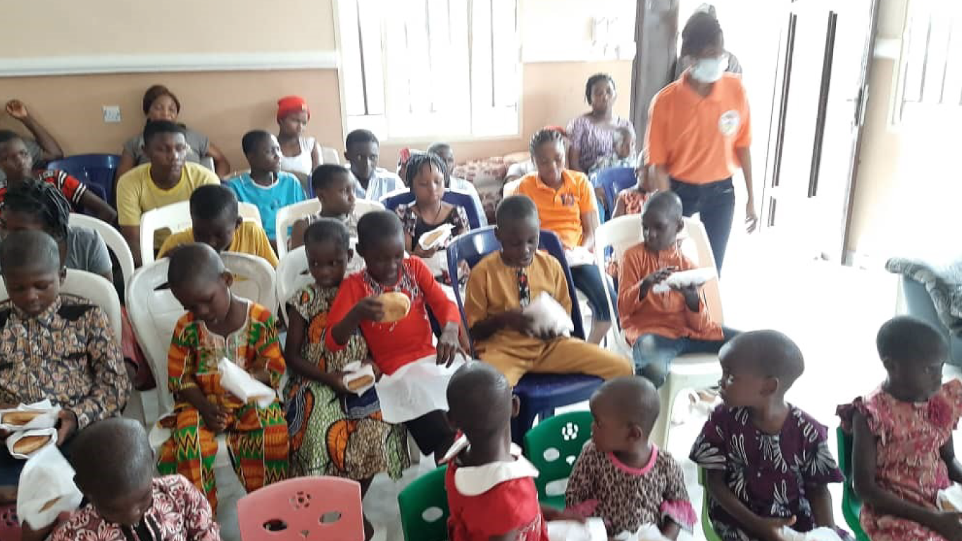 Children eating the refreshment provided by JHF